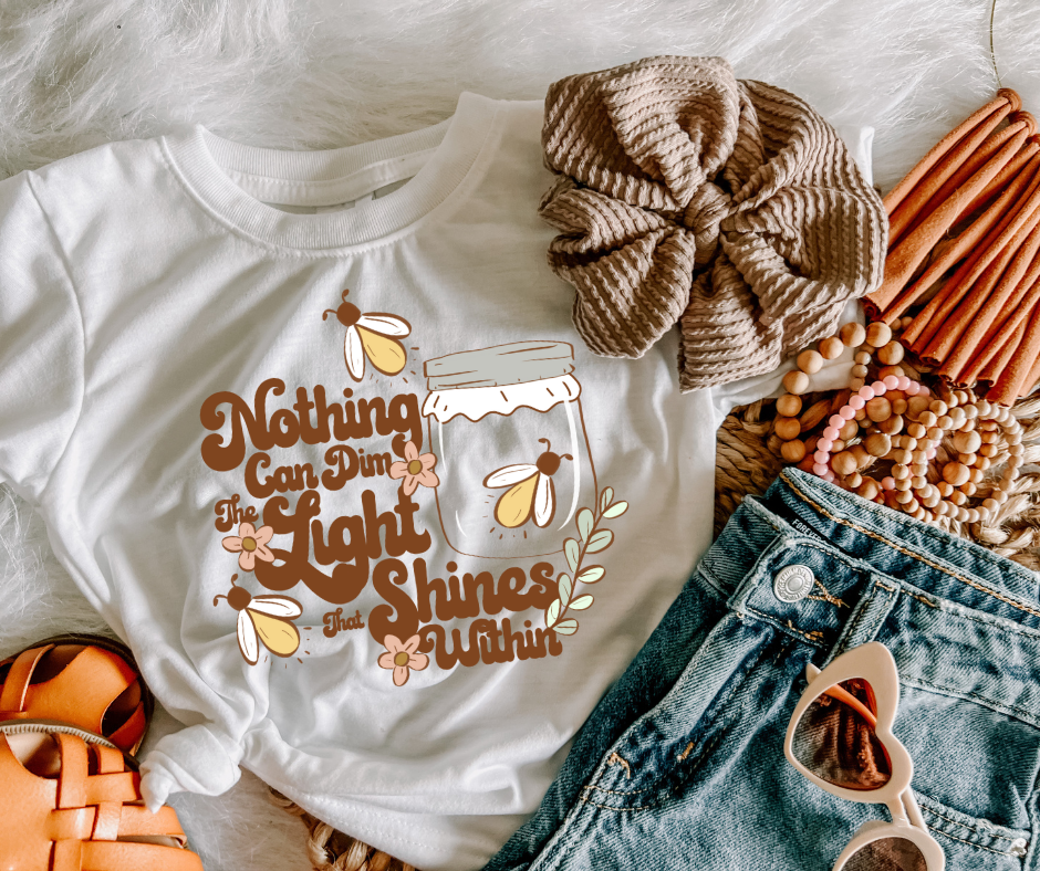 NOTHING CAN DIM THE LIGHT TEE